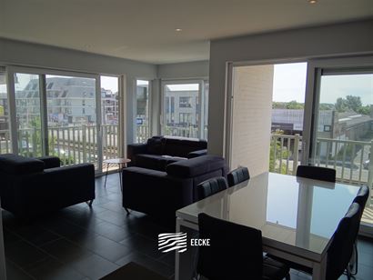 TE HUUR OP JAARBASIS - gemeubeld hoek appartement met 2 slaapkamers met recreatieruimte - living met zonneterras - ingerichte open keuken met elektris...