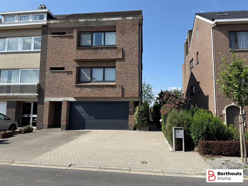 Appartement met tuin en garage 