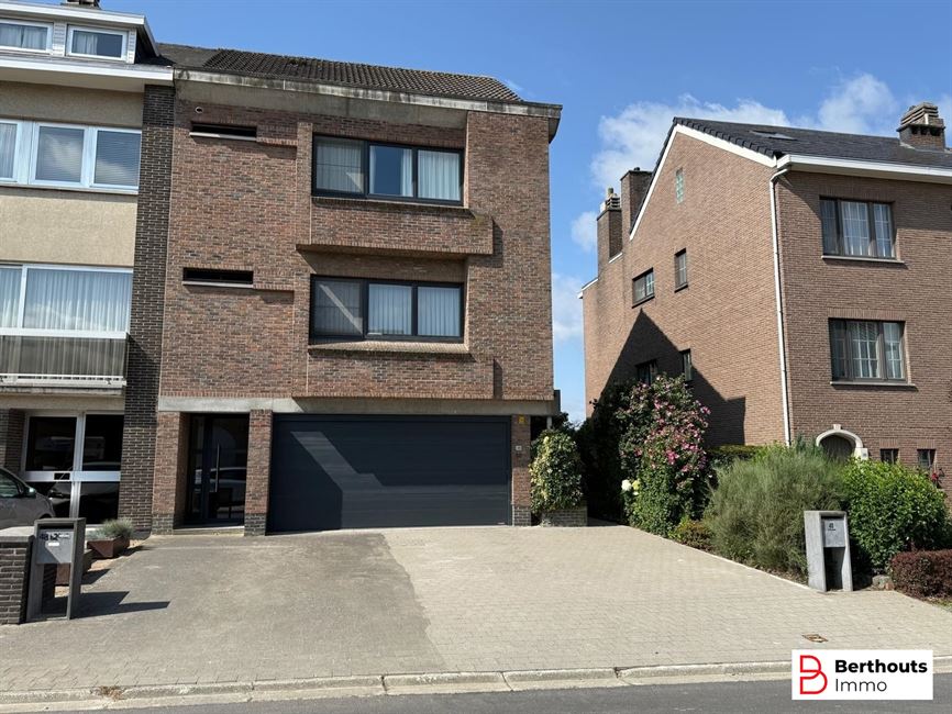Appartement met tuin en garage 