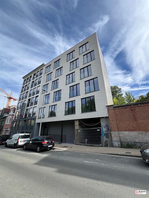 Opbrengsteigendom met 10 appartementen 14 parkings /14 kelders